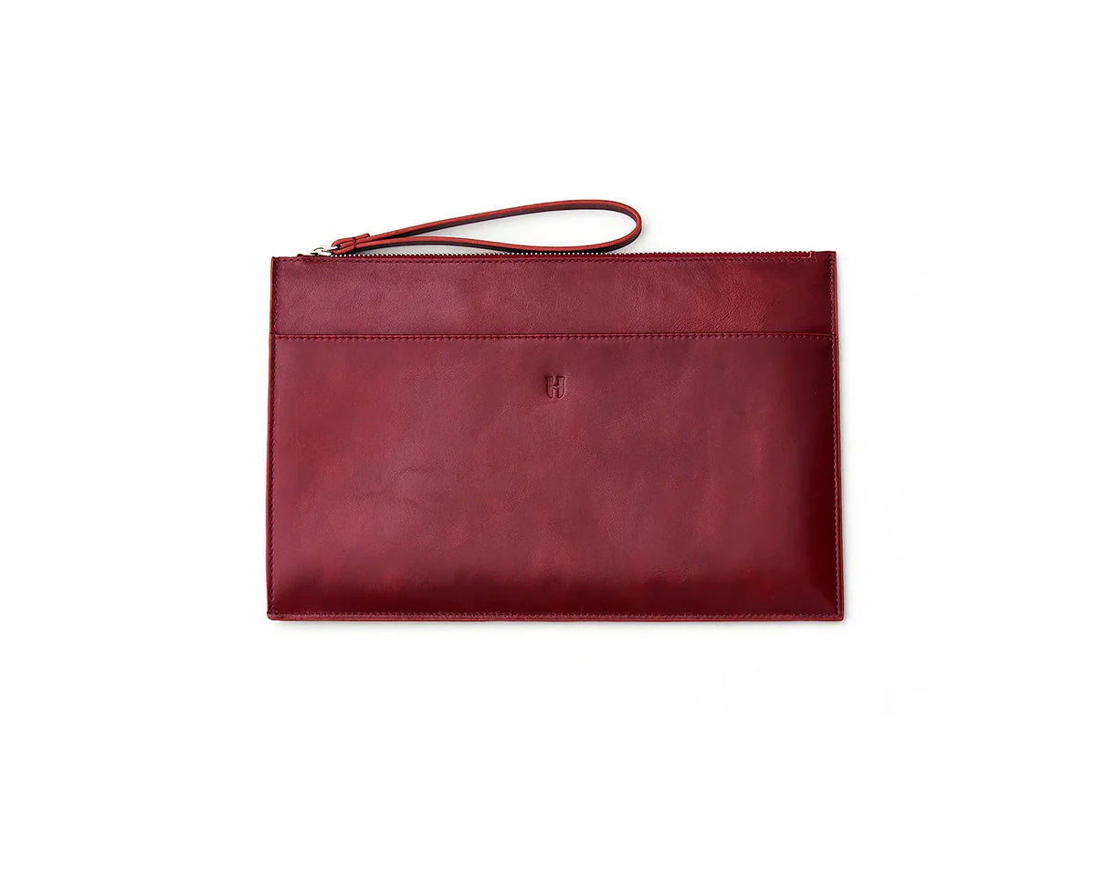 Handmade leather portfolio bag with a secure zipper, ideal for professional office use.