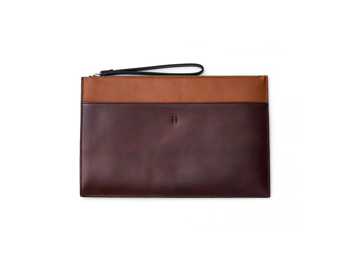 Handmade leather portfolio bag for women, featuring a secure zipper for practical organization.