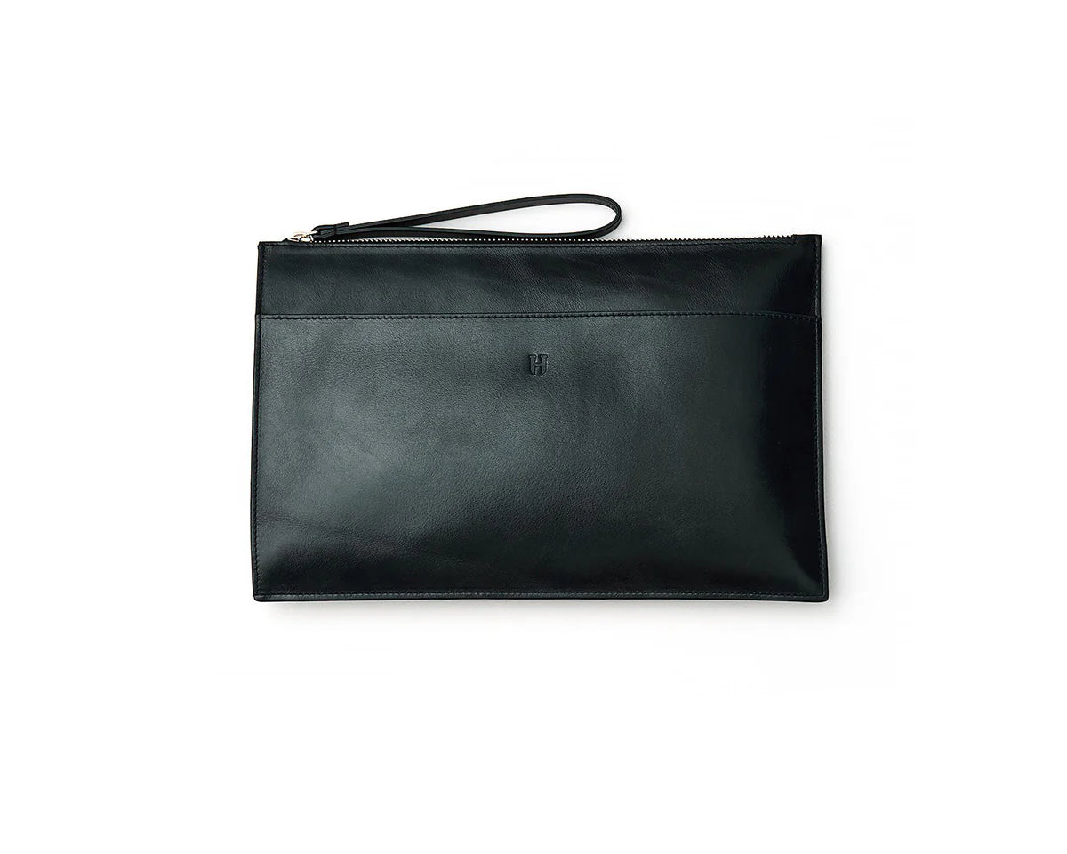 Luxury leather portfolio bag for women, featuring convenient pockets and a sophisticated design.