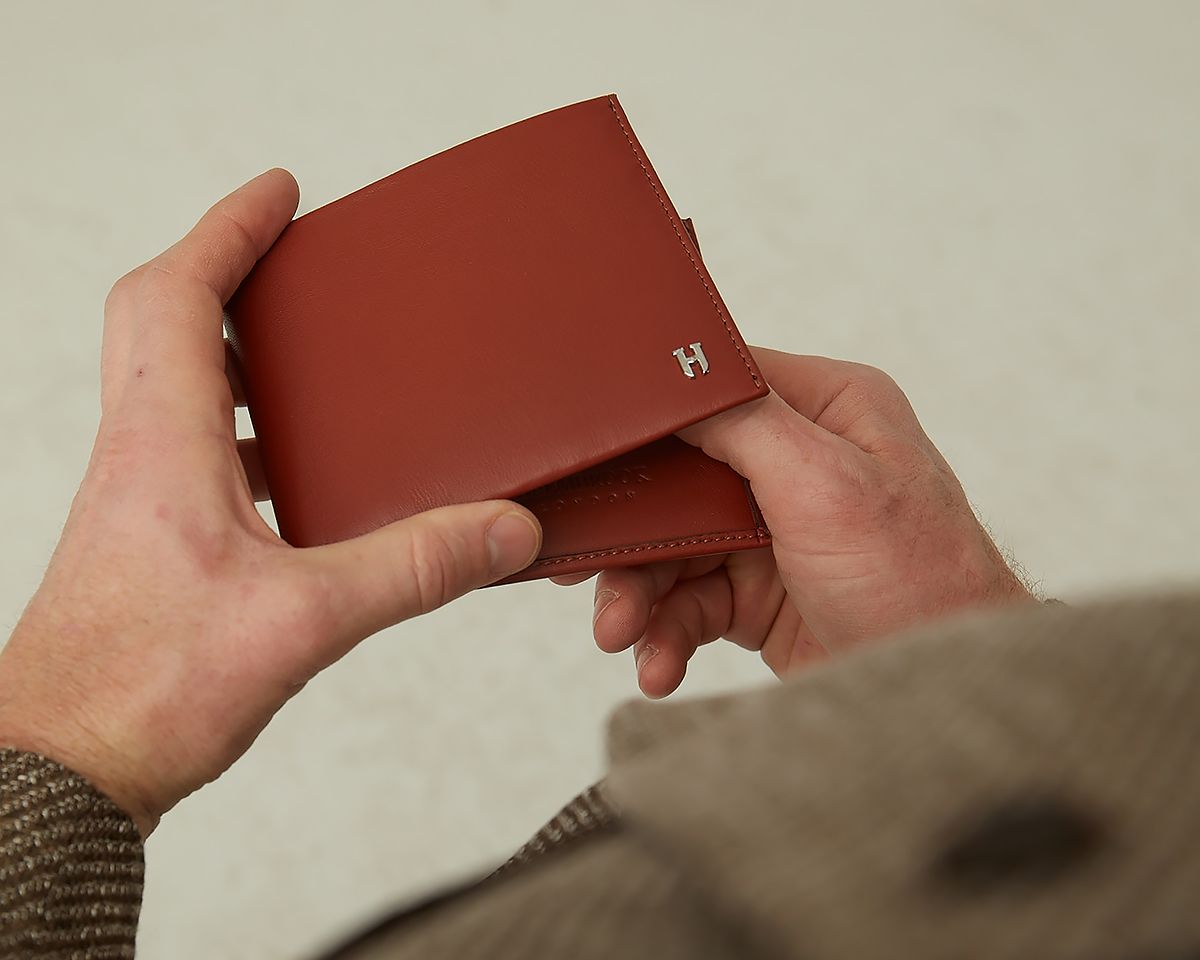 Tanner luxury leather wallet featuring multiple compartments for cards, cash, and essentials.