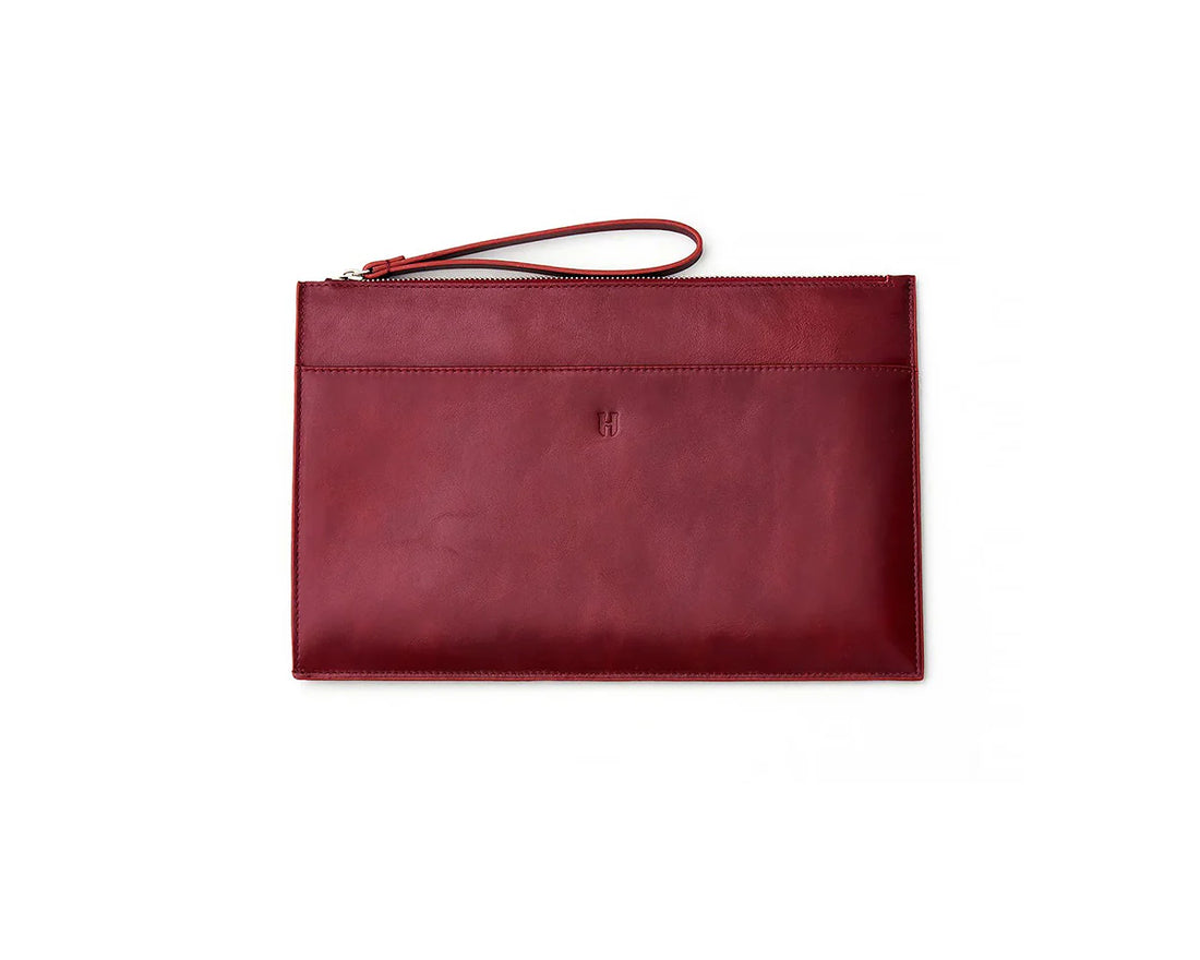 Handmade leather portfolio bag with a secure zipper, ideal for professional office use.